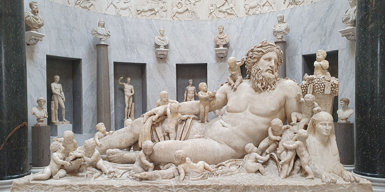 Visitors planning a Colosseum and Vatican Museums day in Rome